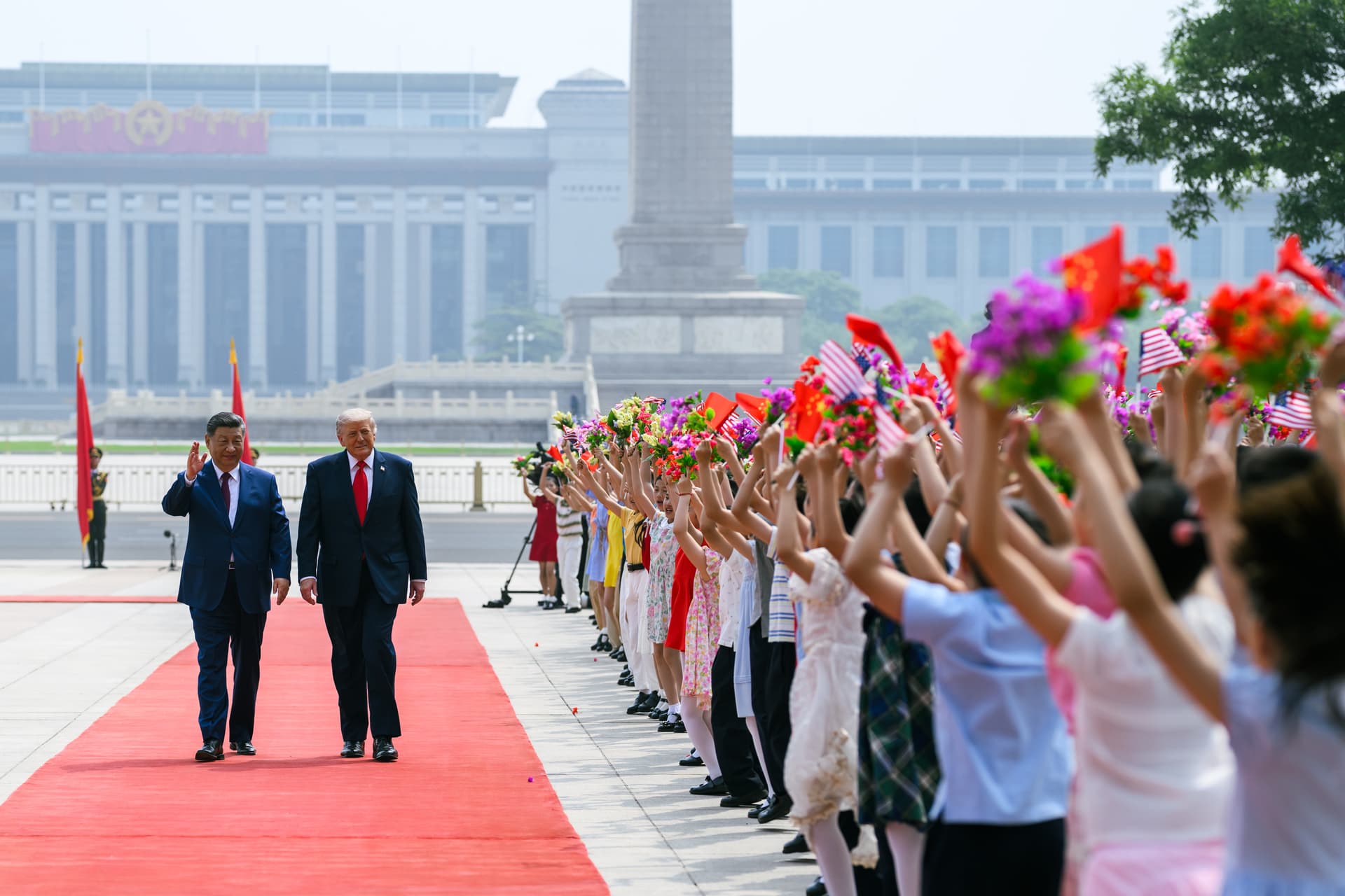 Donald Trump and Xi Jinping at a Beijing welcome ceremony, where diplomacy meets supply chains